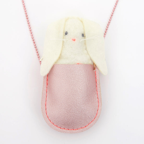 This pretty necklace features a padded felt bunny, sitting in a glittery pink leatherette pocket, with a pink bead chain. Image2