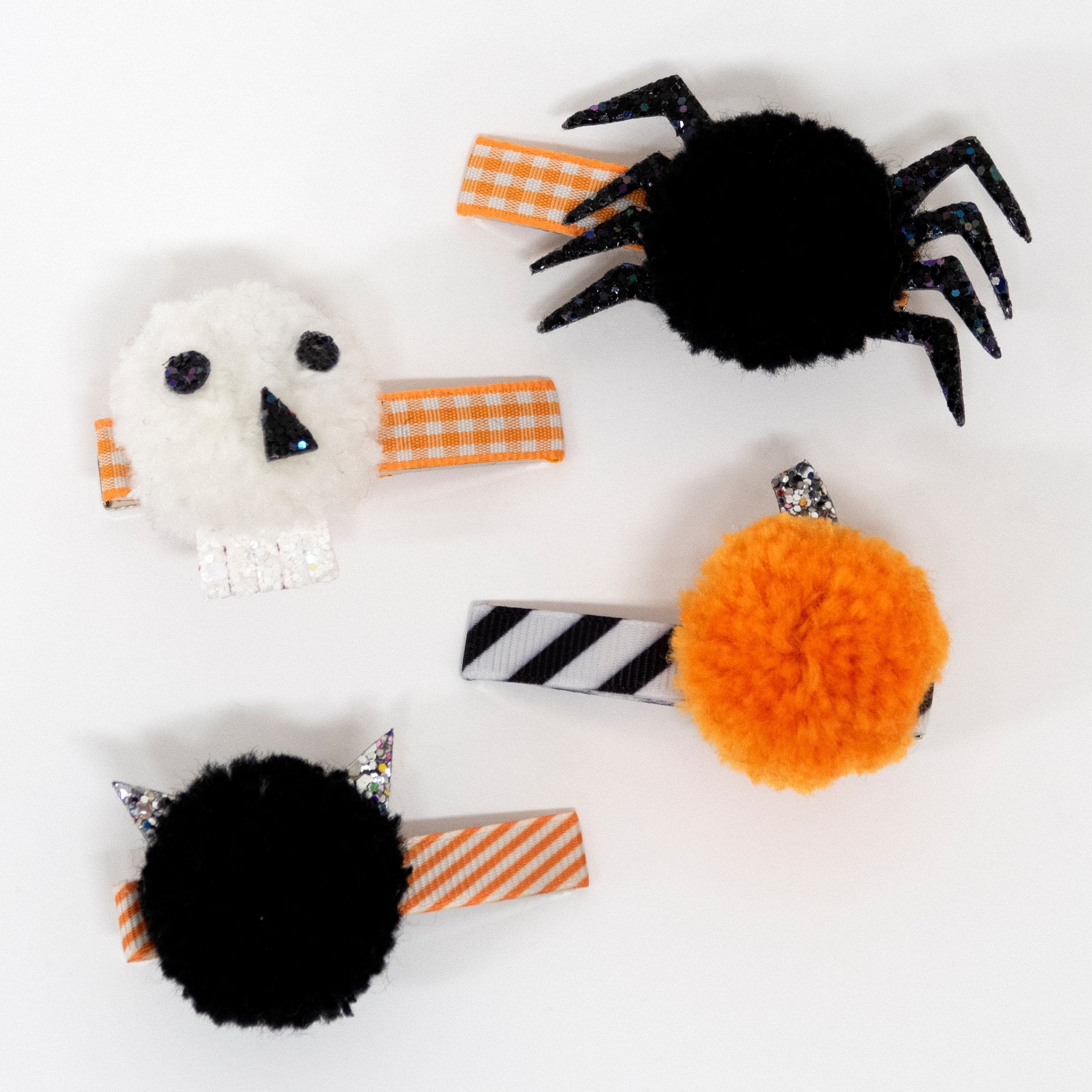 Create the most amazing Halloween hairstyles with these skull, spider, pumpkin and cat pompom clips.
