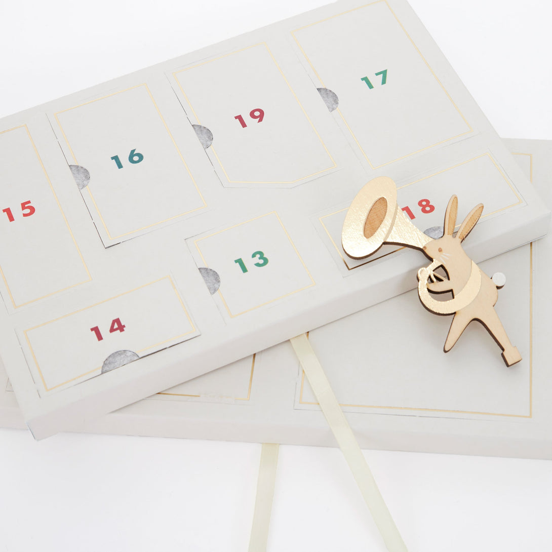 Our kids advent calendar, in a suitcase, features wooden toys for hours of play.