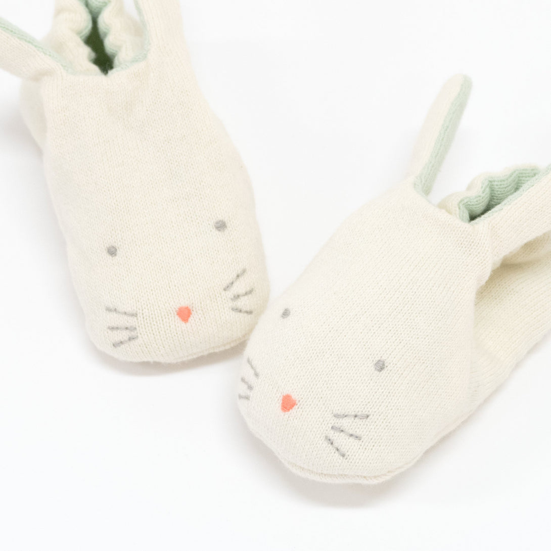 These adorable bunny booties are crafted from knitted organic cotton, with a mint lining, stitched features and floppy ears.