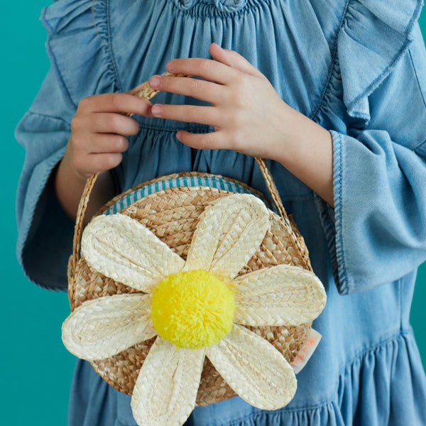 This sensational straw kids bag has a raffia daisy with a yellow pompom in the centre. Image4