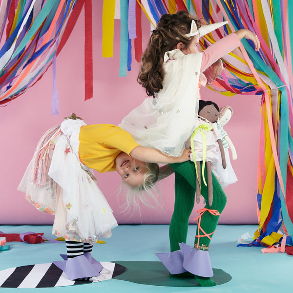 This kids' unicorn costume features a headband with a felt unicorn horn and ear details, and a swishy tail. Image5