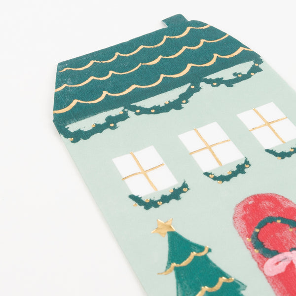 These Christmas paper napkins are designed to look like a home with Christmas decorations and gold foil detail. Image2