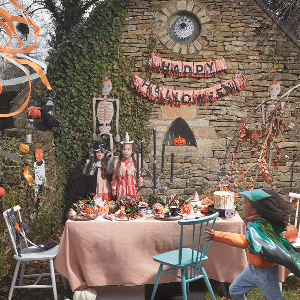 Our fringed paper garland, with Happy Halloween wording, is the perfect Halloween party decoration. Image5