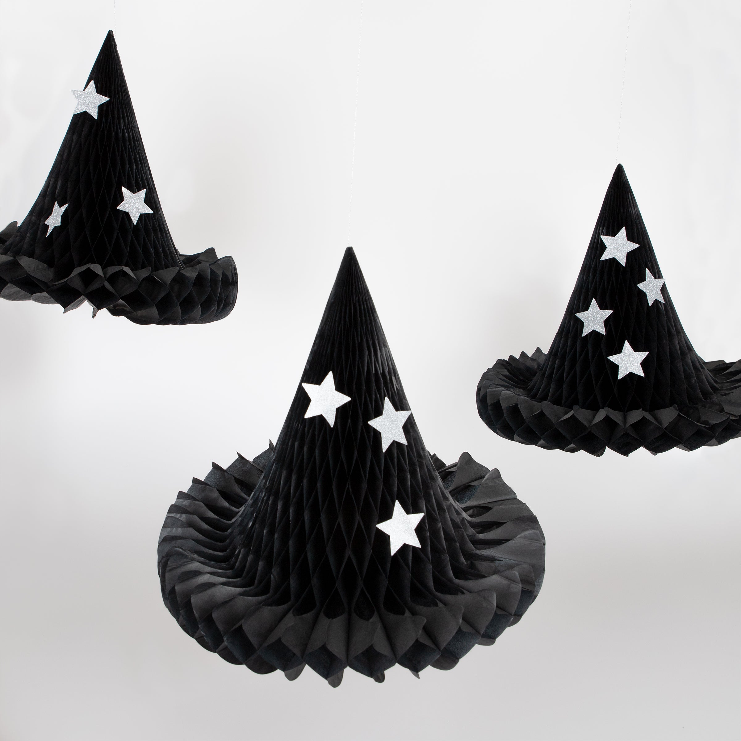 Our witch hats, with silver glitter stars, are the perfect hanging Halloween decorations.