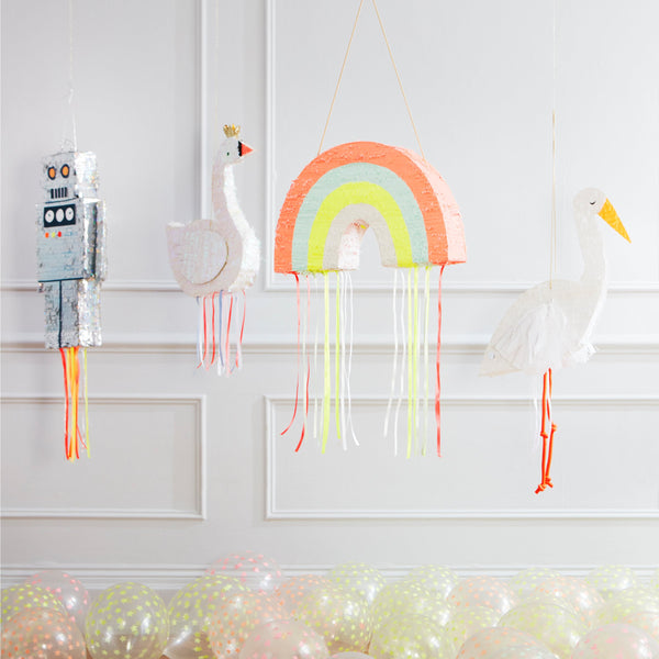 This rainbow pinata is beautifully decorated with colourful stripes and hanging ribbons. Image7