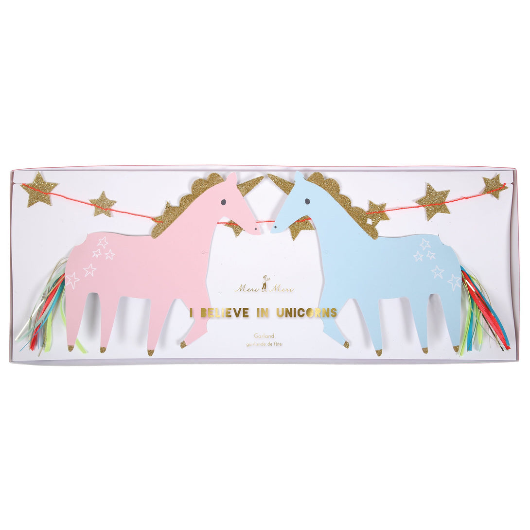 This wonderful unicorn party decoration include pastel unicorns, gold glitter, ribbons and the words "I Believe in Unicorns".